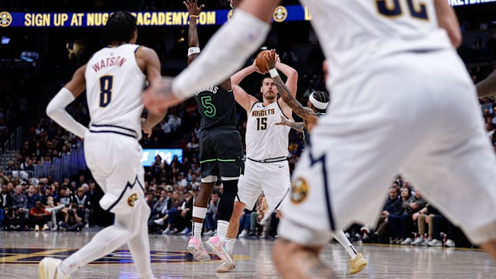 Nikola Jokic faces one of many double-teams from the Minnesota Timberwolves.