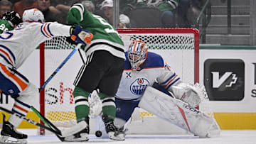 Nov 4, 2025; Dallas, Texas, USA; Edmonton Oilers goaltender Stuart Skinner (74) stops a shot by Dallas Stars center Wyatt Johnston (53) during the first period at the American Airlines Center. Mandatory Credit: Jerome Miron-Imagn Images