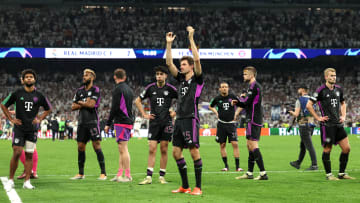 Bayern Munich players applauding fans after defeat against Real Madrid.