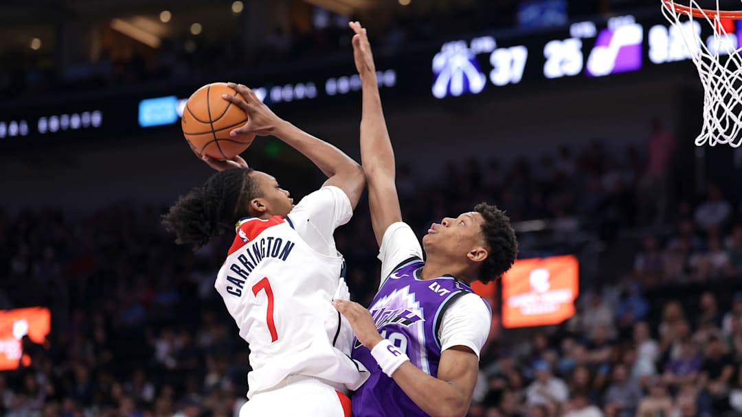 Mar 25, 2026; Salt Lake City, Utah, USA;  Utah Jazz forward Ace Bailey (19) defends against Washington Wizards guard Bub Carrington (7) during the second quarter at Delta Center. Mandatory Credit: Chris Nicoll-Imagn Images