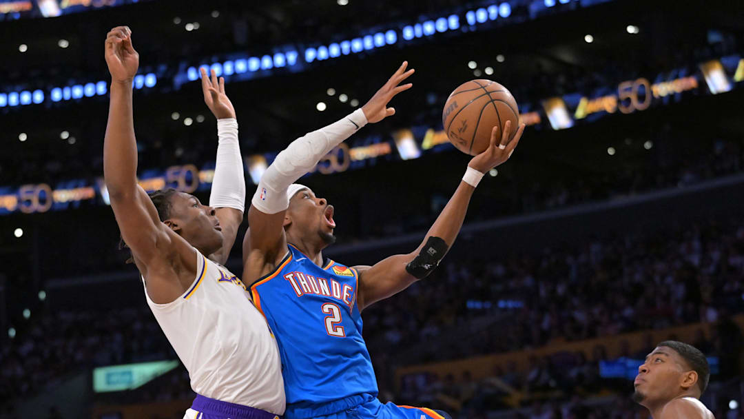 May 9, 2026; Los Angeles, California, USA; Oklahoma City Thunder guard Shai Gilgeous-Alexander (2) drives past Los Angeles Lakers forward Adou Thiero (1) in the second half of game three of the second round of the 2026 NBA Playoffs at Crypto.com Arena. Mandatory Credit: Jayne Kamin-Oncea-Imagn Images