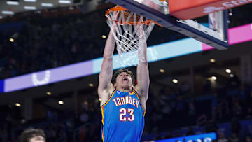 Nov 23, 2025; Oklahoma City, Oklahoma, USA; Oklahoma City Thunder forward Brooks Barnhizer (23) dunks against the Portland Trail Blazers during the second half at Paycom Center. Mandatory Credit: Alonzo Adams-Imagn Images