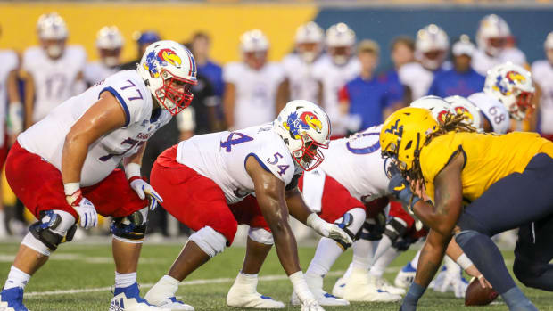 Kansas Jayhawks offensive lineman Michael Ford Jr. (54) pauses before the snap. Ben Queen-USA TODAY Sports