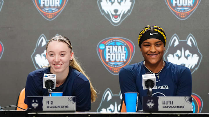 Apr 4, 2024; Cleveland, OH, USA; UConn Huskies coach Geno Auriemma (left), guard Paige Bueckers (center) and forward Aaliyah Edwards during press conference at Rocket Mortgage FieldHouse. Mandatory Credit: Kirby Lee-Imagn Images Apr 4, 2024; Cleveland, OH, USA; UConn Huskies coach Geno Auriemma (left), guard Paige Bueckers (center) and forward Aaliyah Edwards during press conference at Rocket Mortgage FieldHouse. Mandatory Credit: Kirby Lee-Imagn Images