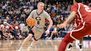 Mar 12, 2025; Nashville, TN, USA;  Georgia Bulldogs guard Blue Cain (0) dribbles the ball against the Oklahoma Sooners during the first half at Bridgestone Arena. Mandatory Credit: Steve Roberts-Imagn Images