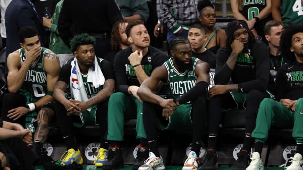 Boston Celtics Jayson Tatum, Marcus Smart, Blake Griffin, and Jaylen Brown react from the bench during Game 7 vs. the Heat.