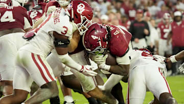 Nov 15, 2025; Tuscaloosa, Alabama, USA;  Alabama Crimson Tide running back Daniel Hill (4) runs into the end zone for a touchdown as Oklahoma Sooners defensive back Robert Spears-Jennings (3) closes in at Saban Field at Bryant-Denny Stadium. Oklahoma defeated Alabama 23-21. Mandatory Credit: Gary Cosby Jr.-Imagn Images