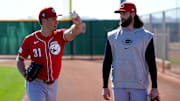Feb 20, 2024; Goodyear, AZ, USA; Cincinnati Reds relief pitcher Brent Suter (31), left, and Cincinnati Reds relief pitcher Tejay Antone (70), right, talk after long tossing during spring training workouts at Goodyear Ballpark. Mandatory Credit: Kareem Elgazzar-Imagn Images