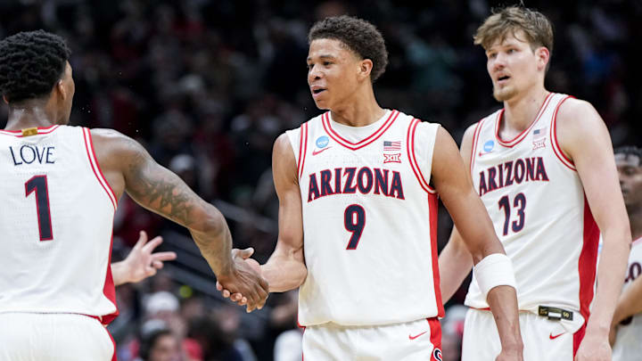 Mar 23, 2025; Seattle, WA, USA; Arizona Wildcats guard Caleb Love (1) high-fives forward Carter Bryant (9) during a stop in play against the Oregon Ducks in the second half at Climate Pledge Arena. Mandatory Credit: Stephen Brashear-Imagn Images Mar 23, 2025; Seattle, WA, USA; Arizona Wildcats guard Caleb Love (1) high-fives forward Carter Bryant (9) during a stop in play against the Oregon Ducks in the second half at Climate Pledge Arena. Mandatory Credit: Stephen Brashear-Imagn Images
