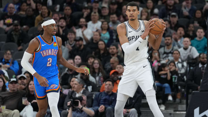 Feb 29, 2024; San Antonio, Texas, USA;  San Antonio Spurs center Victor Wembanyama (1) looks down the court beside Oklahoma City Thunder guard Shai Gilgeous-Alexander (2) in the first half at Frost Bank Center. Mandatory Credit: Daniel Dunn-USA TODAY Sports