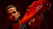 Harry Kane holds his first signature boot with Skechers.