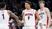 Arizona guard Caleb Love (1) high-fives forward Carter Bryant (9) during the Wildcats' NCAA Tournament win over Oregon.