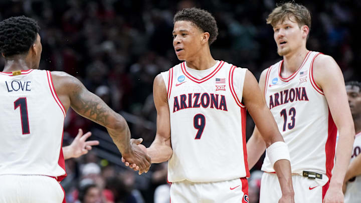Arizona guard Caleb Love (1) high-fives forward Carter Bryant (9) during the Wildcats' NCAA Tournament win over Oregon. Arizona guard Caleb Love (1) high-fives forward Carter Bryant (9) during the Wildcats' NCAA Tournament win over Oregon.