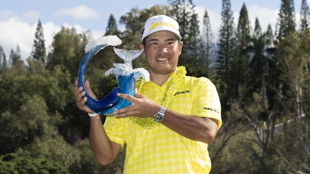 Hideki Matsuyama celebrates with the trophy after winning during the final round of The Sentry 