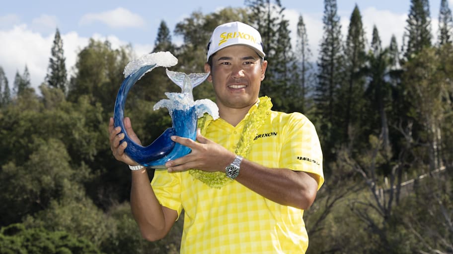 Hideki Matsuyama celebrates with the trophy after winning during the final round of The Sentry