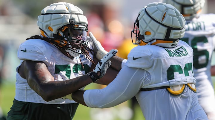 Green Bay Packers offensive linemen Caleb Jones (72) and Rasheed Walker (63) run through a drill during practice on Tuesday, August 20, 2024, at Ray Nitschke Field in Ashwaubenon, Wis. 
Tork Mason/USA TODAY NETWORK-Wisconsin