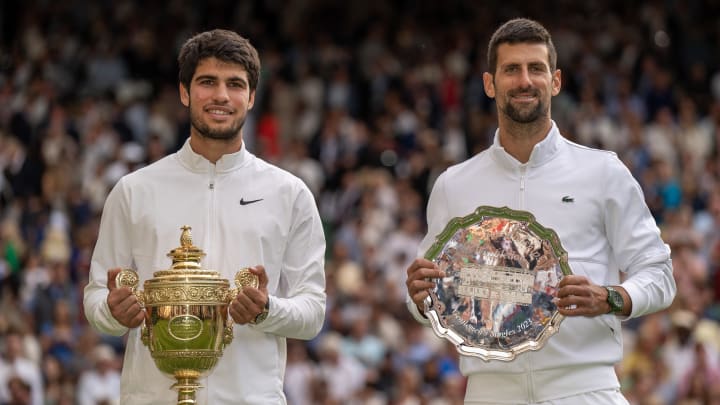 Jul 16, 2023; London, United Kingdom; Carlos Alcaraz (ESP) and Novak Djokovic (SRB) pose with their trophies after the men   s singles final on day 14 at  the All England Lawn Tennis and Croquet Club. Mandatory Credit: Susan Mullane-USA TODAY Sports