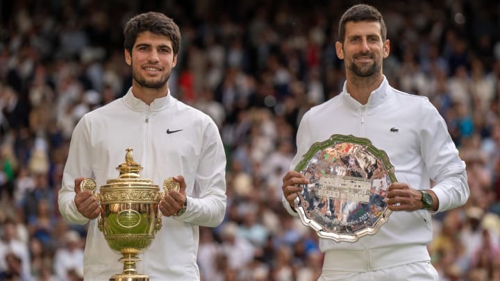 Jul 16, 2023; London, United Kingdom; Carlos Alcaraz (ESP) and Novak Djokovic (SRB) pose with their trophies after the men   s singles final on day 14 at  the All England Lawn Tennis and Croquet Club. Mandatory Credit: Susan Mullane-USA TODAY Sports