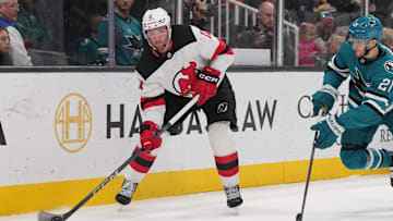 Jan 4, 2025; San Jose, California, USA; New Jersey Devils right wing Stefan Noesen (11) passes against San Jose Sharks center Alexander Wennberg (21) during the first period at SAP Center at San Jose. Mandatory Credit: Darren Yamashita-Imagn Images