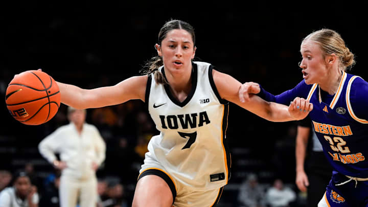 Iowa guard Addie Deal (7) dribbles the ball as Western Illinois guard Kaylen Reed (32) defends Nov. 26, 2025 at Carver-Hawkeye Arena in Iowa City, Iowa.