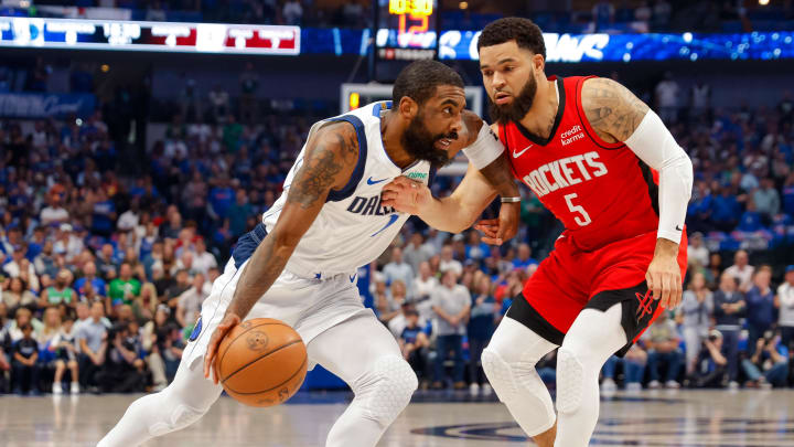 Apr 7, 2024; Dallas, Texas, USA; Dallas Mavericks guard Kyrie Irving (11) drives around Houston Rockets guard Fred VanVleet (5) during the first quarter at American Airlines Center. Mandatory Credit: Andrew Dieb-USA TODAY Sports