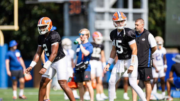 Florida Gators quarterback DJ Lagway (2) and Florida Gators quarterback Graham Mertz (15) line up during fall football practi