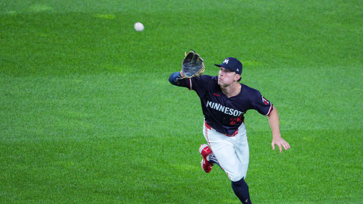 Minnesota Twins outfielder Max Kepler (26) fields a fly ball against the Tampa Bay Rays in the eighth inning at Target Field in Minneapolis on June 18, 2024. 