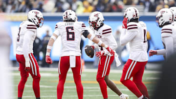 Nov 29, 2025; Morgantown, West Virginia, USA; Texas Tech Red Raiders cornerback Brice Pollock (14) celebrates after an interception during the second quarter against the West Virginia Mountaineers at Milan Puskar Stadium. Mandatory Credit: Ben Queen-Imagn Images