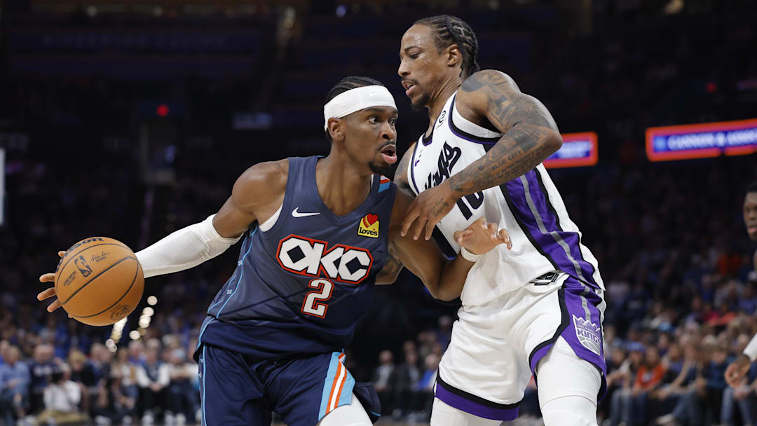 Nov 19, 2025; Oklahoma City, Oklahoma, USA; Oklahoma City Thunder guard Shai Gilgeous-Alexander (2) moves past Sacramento Kings guard DeMar DeRozan (10) during the second half at Paycom Center. Mandatory Credit: Alonzo Adams-Imagn Images