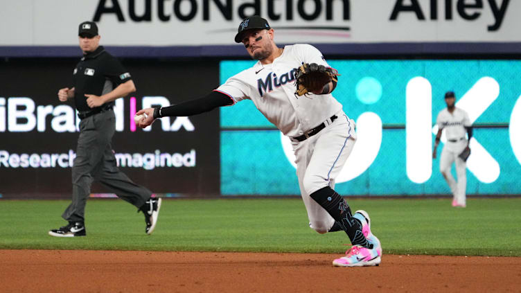 Sep 20, 2022; Miami, Florida, USA; Miami Marlins shortstop Miguel Rojas (11) throws out Chicago Cubs