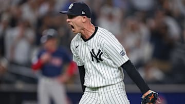 Sep 13, 2024; Bronx, New York, USA; New York Yankees relief pitcher Luke Weaver (30) reacts after closing the game against the Boston Red Sox at Yankee Stadium. Mandatory Credit: Vincent Carchietta-Imagn Images