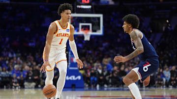 Nov 30, 2025; Philadelphia, Pennsylvania, USA; Atlanta Hawks forward Jalen Johnson (1) controls the ball against Philadelphia 76ers forward Dominick Barlow (25) in the first quarter at Xfinity Mobile Arena. Mandatory Credit: Kyle Ross-Imagn Images