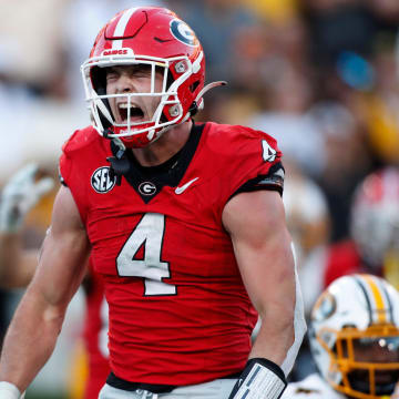 Georgia tight end Oscar Delp (4) celebrates after scoring a touchdown during the second half of a NCAA college football game against Missouri in Athens, Ga., on Saturday, Nov. 4, 2023. Georgia won 30-21.