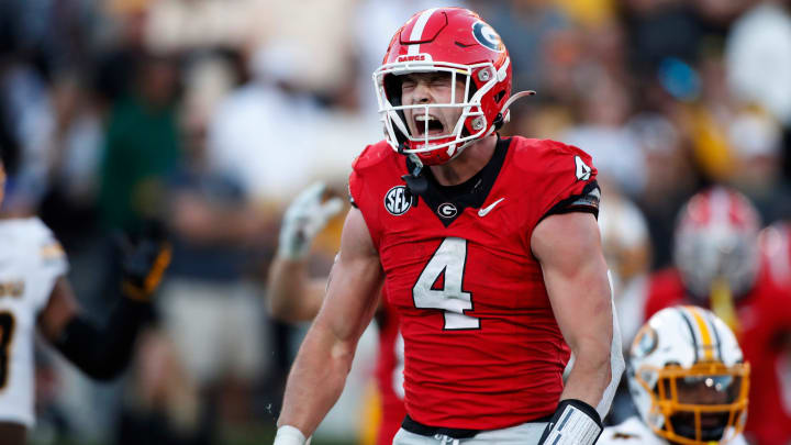 Georgia tight end Oscar Delp (4) celebrates after scoring a touchdown during the second half of a NCAA college football game against Missouri in Athens, Ga., on Saturday, Nov. 4, 2023. Georgia won 30-21.