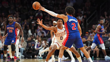 Oct 11, 2024; Phoenix, Arizona, USA; Phoenix Suns forward Ryan Dunn (0) guards Detroit Pistons guard Cade Cunningham (20: Joe Camporeale-Imagn Images