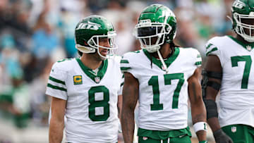 Dec 15, 2024; Jacksonville, Florida, USA; New York Jets quarterback Aaron Rodgers (8) and wide receiver Davante Adams (17) was out to the field after a turnover against the Jacksonville Jaguars in the first quarter at EverBank Stadium. Mandatory Credit: