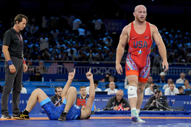 Wrestler walks off after loss.