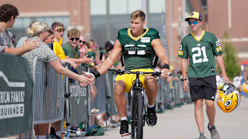 Green Bay Packers defensive lineman Lukas Van Ness (90) participates in the Dream Drive bicycle ride before practice on Aug. 5, 2025, in Green Bay, Wis.