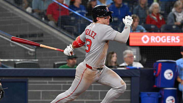 Sep 24, 2025; Toronto, Ontario, CAN;  Boston Red Sox second baseman Romy Gonzalez (23) hits a single against the Toronto Blue Jays in the eighth inning at Rogers Centre. Mandatory Credit: Dan Hamilton-Imagn Images