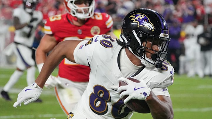 Baltimore Ravens tight end Isaiah Likely (80) runs the ball against the Kansas City Chiefs during the second half at GEHA Field at Arrowhead Stadium. 