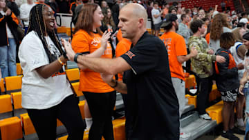 Oklahoma State coach Steve Lutz celebrates with fans after a college basketball game between the Oklahoma State Cowboys (OSU) and the Green Bay Phoenix at Gallagher-Iba Arena in Stillwater, Okla., Monday, Nov. 4, 2024.