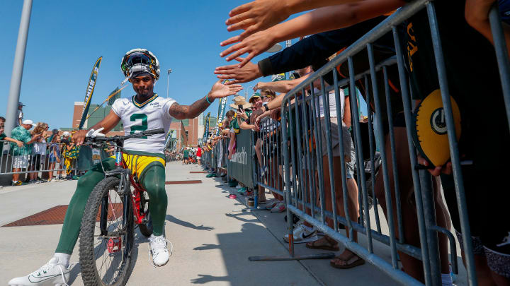 Green Bay Packers wide receiver Jalen Wayne takes a bike to training camp.