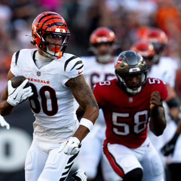 Cincinnati Bengals wide receiver Andrei Iosivas (80) runs after the catch for a first down in the first quarter of the NFL preseason game against the Tampa Bay Buccaneers at Paycor Stadium in Cincinnati Saturday, August 10, 2024.