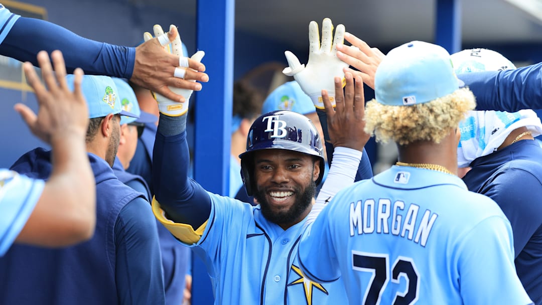 Feb 27, 2026; Port Charlotte, Florida, USA; Tampa Bay Rays center fielder Cedric Mullins (31) is congratulated after he hit a solo home run during the third inning against the Toronto Blue Jays at Charlotte Sports Park. 
