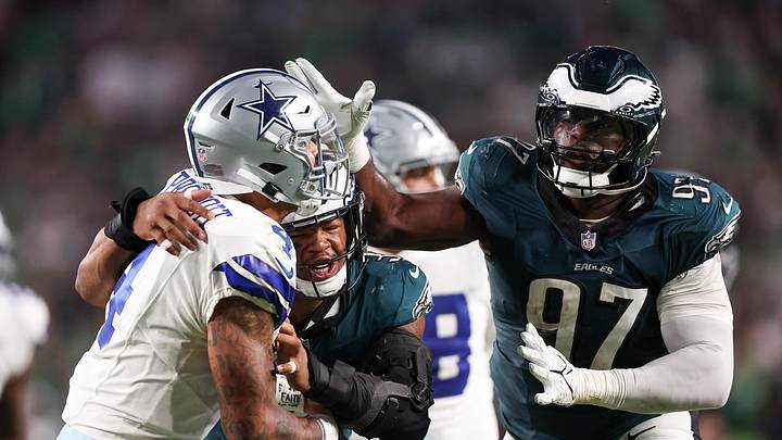 Sep 4, 2025; Philadelphia, Pennsylvania, USA; Philadelphia Eagles place kicker Jake Elliott (4) is hit by Philadelphia Eagles linebacker Nolan Smith Jr. (3) and defensive tackle Moro Ojomo (97) after a pass during the fourth quarter of the game at Lincoln Financial Field. Mandatory Credit: Bill Streicher-Imagn Images