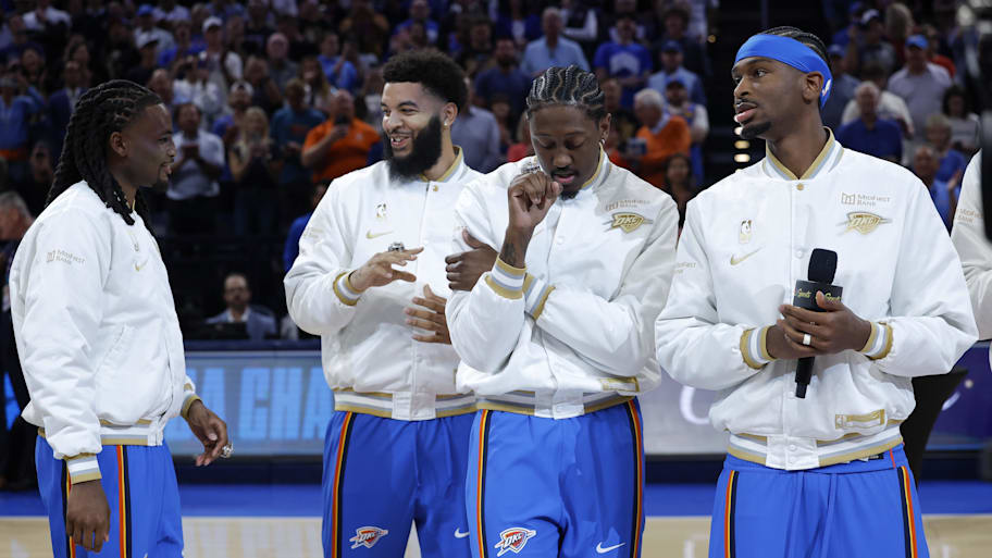 Oklahoma City’s Cason Wallace, Kenrich Williams, Jalen Williams and Shai Gilgeous-Alexander receiving their title rings.