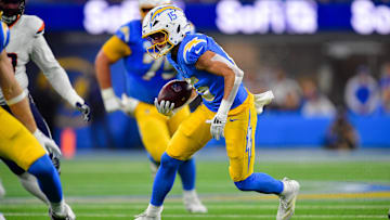 Dec 19, 2024; Inglewood, California, USA; Los Angeles Chargers wide receiver Ladd McConkey (15) runs the ball against the Denver Broncos during the second half at SoFi Stadium. Mandatory Credit: Gary A. Vasquez-Imagn Images