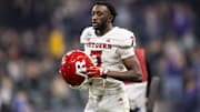 Dec 26, 2024; Phoenix, AZ, USA; Rutgers Scarlet Knights defensive back Robert Longerbeam (7) against the Kansas State Wildcats during the Rate Bowl at Chase Field. Mandatory Credit: Mark J. Rebilas-Imagn Images