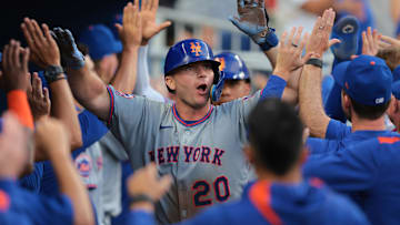 Apr 2, 2025; Miami, Florida, USA; New York Mets first baseman Pete Alonso (20) celebrates with teammates after hitting a three-run home run against the Miami Marlins during the eighth inning at loanDepot Park. Mandatory Credit: Sam Navarro-Imagn Images