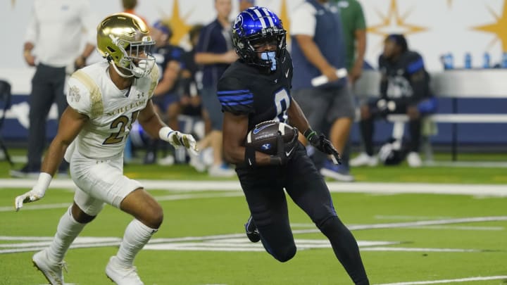 Oct 8, 2022; Paradise, Nevada, USA; Brigham Young Cougars wide receiver Kody Epps (0) runs with the all against Notre Dame.